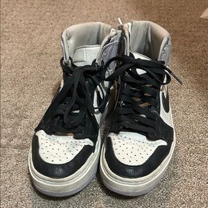 Nike Jordans Black and White High-Top Sneakers with Purple Accents and a Zipper